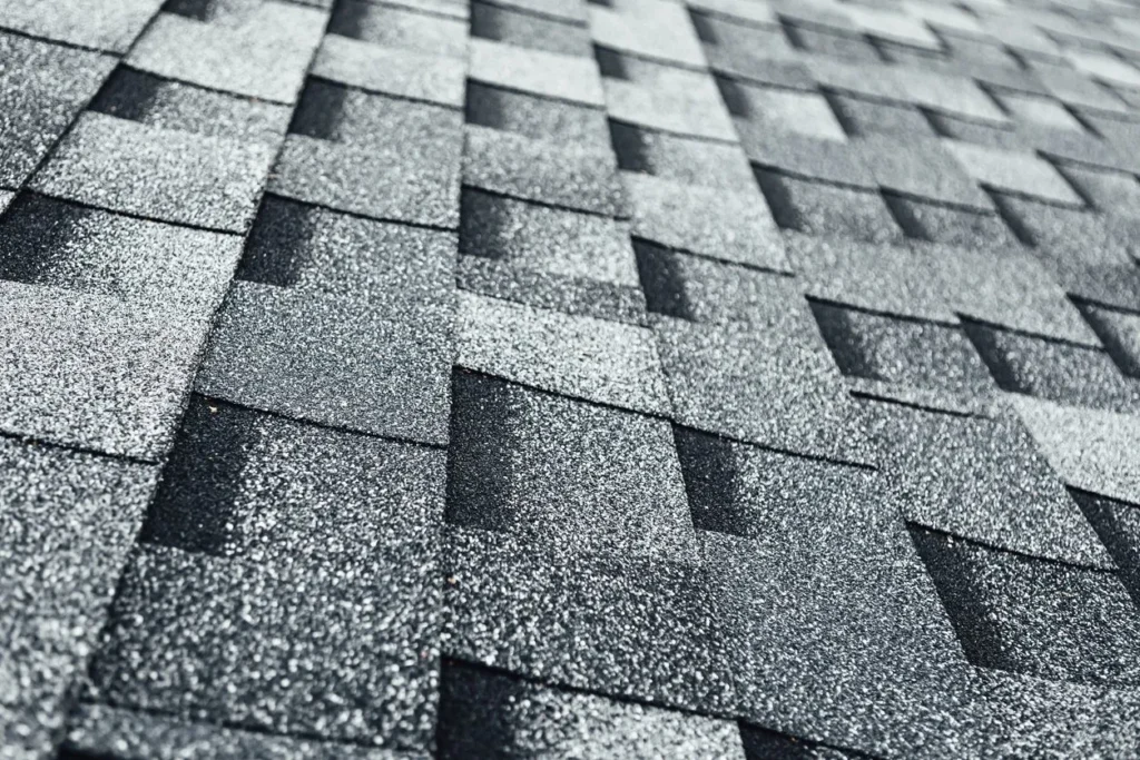Close-up of gray asphalt roof shingles.