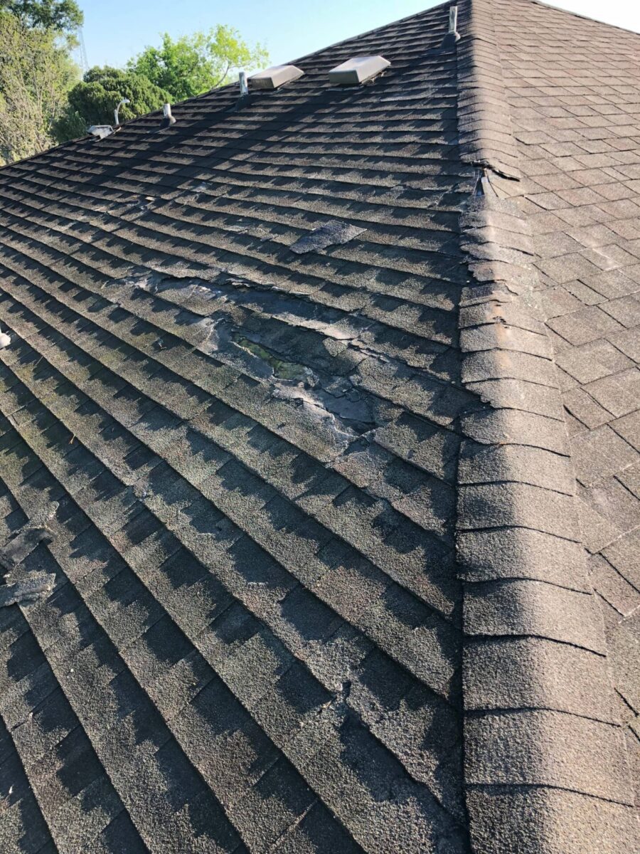 close up image of roof with shingle granule loss and roof damage in lexington